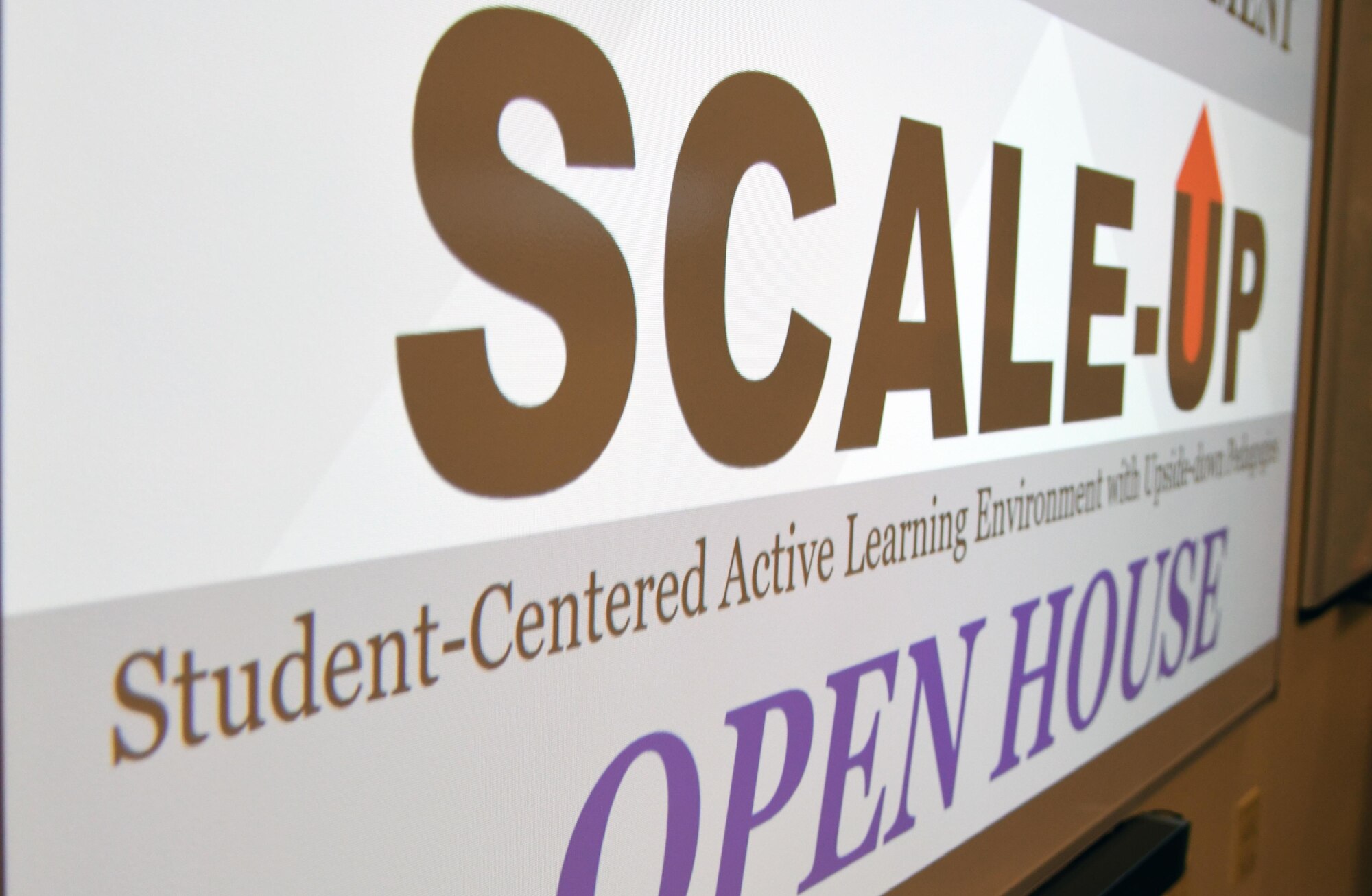 A Student-Centered Active Learning Environment with Upside-down Pedagogies slide is displayed during the SCALE-UP ribbon cutting ceremony inside Allee Hall at Keesler Air Force Base, Mississippi, Jan. 10, 2019. The program was introduced by the 81st Training Support Squadron as a way to bring new technology and teaching techniques into Keesler classrooms to put more focus on students and their success in Air Force education. The new program has also brought a new way to teach basic skills like time management and critical thinking to the students while learning their career field. (U.S. Air Force photo by Kemberly Groue)