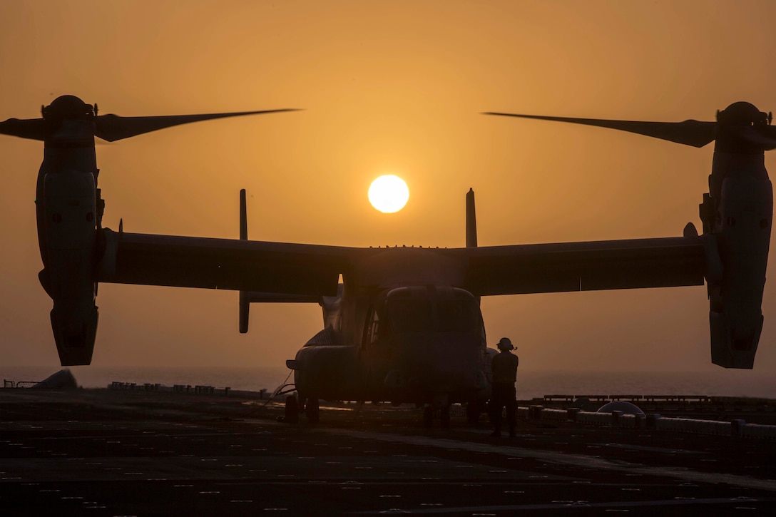 ARABIAN SEA – U.S. Navy Aviation Boatsmate Handler Airmen Bryan Sanchez, assigned with the Essex Amphibious Ready Group (ARG), prepares a U.S. Marine Corps MV-22B Osprey with Marine Medium Tiltrotor Squadron 166 Reinforced, 13th Marine Expeditionary Unit (MEU), for takeoff while aboard the Wasp-class amphibious assault ship USS Essex (LHD 2), Jan. 5, 2019. The Essex is the flagship for the Essex ARG and, with the embarked 13th MEU, is deployed to the U.S. 5th Fleet area of operations in support of naval operations to ensure maritime stability in the Central Region, connecting the Mediterranean and the Pacific through the western Indian Ocean and three strategic choke points. (U.S. Marine Corps photo by Sgt. Francisco J. Diaz Jr./Released)