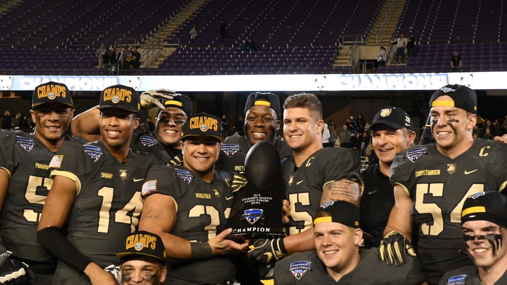 The U.S. Army team poses with the 2018 Armed Forces Bowl championship trophy, Dec. 22, 2018, at Fort Worth, Texas. This game tied for the highest scoring bowl game of all time. (U.S. Air Force photo by Amn Dallin Wrye)