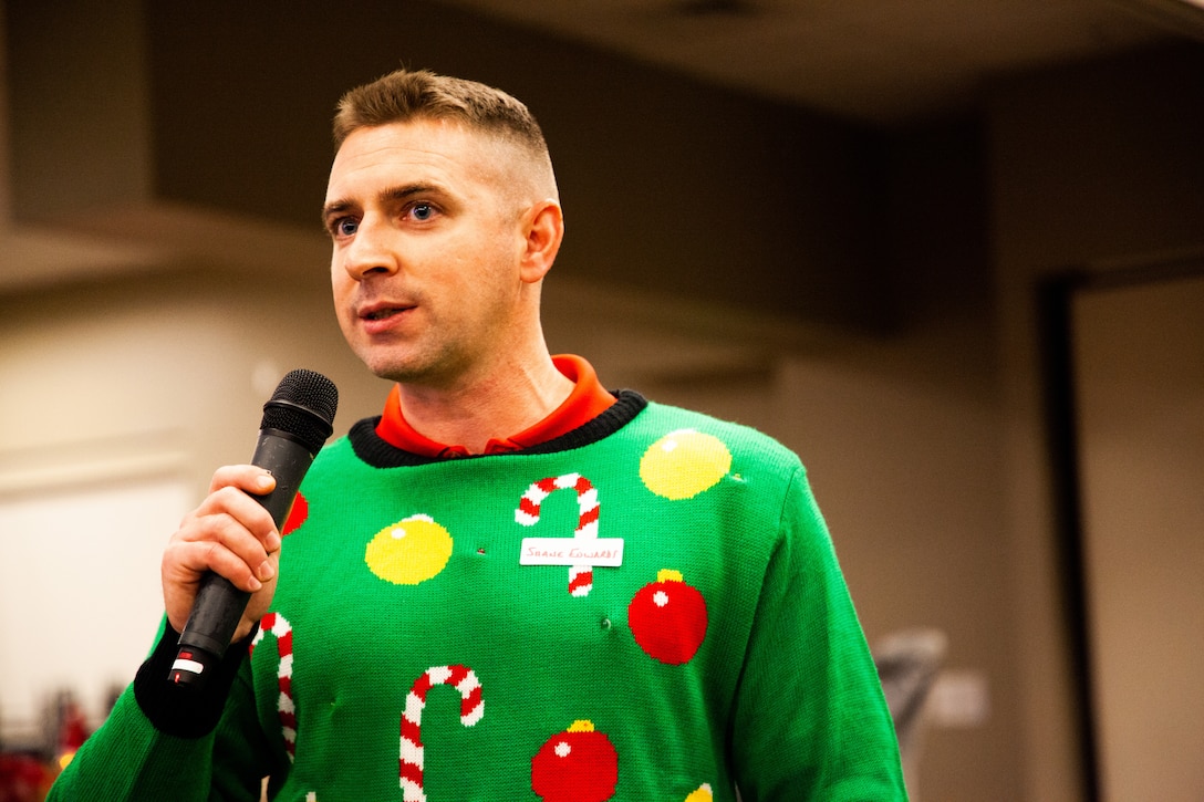 U.S. Marine Corps Lt. Col. Shane Edwards, commanding officer, Headquarters Battalion (HQBN), speaks to attendees at the annual battalion holiday party at Marine Corps Air Ground Combat Center, Twentynine Palms, Calif., Dec. 14, 2018. HQBN leadership hosted the event to express gratitude for the sacrifices made by Marines and their families, and to provide a venue for them to relax and unwind while enhancing unit morale and well-being. (U.S. Marine Corps Photo by Pfc. Aaron Harshaw