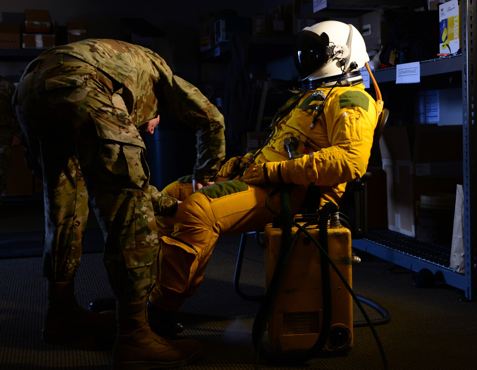 Senior Airman Jonathan Branson, 9th Physiological Support Squadron launch and recovery technician, prepares a U-2 Dragon Lady pilot for a flight