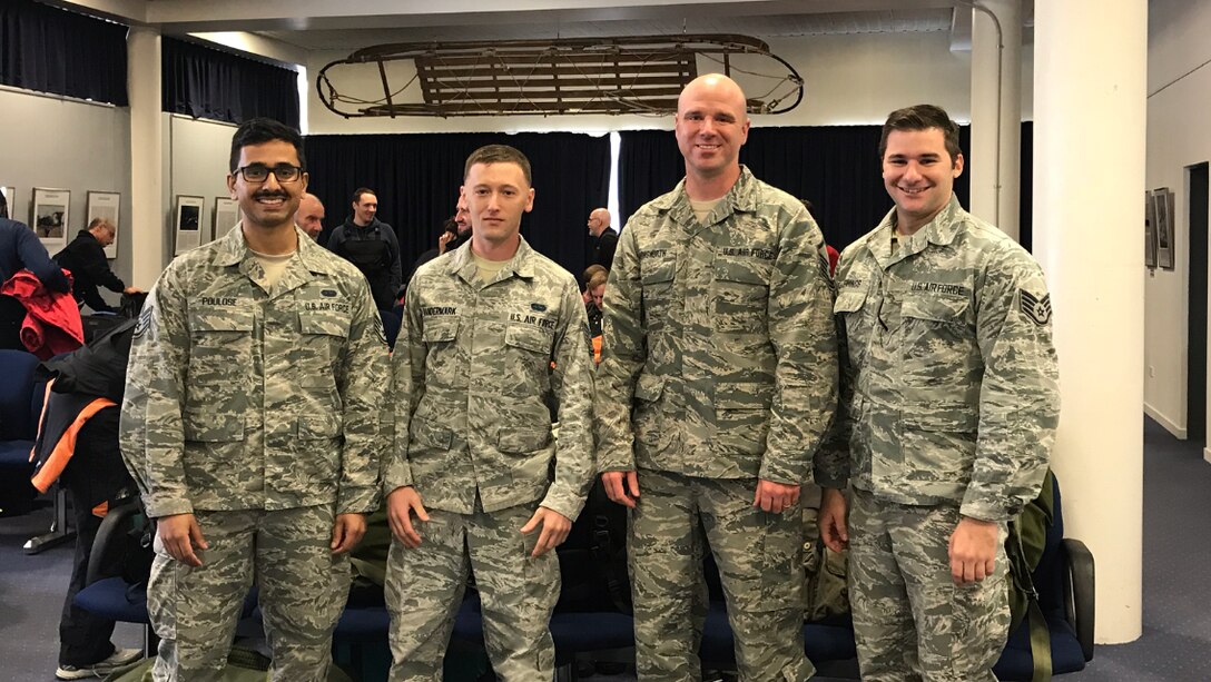 U.S. Air Force Staff Sgt. Titus Poulose (far left), Staff Sgt. Kristofer Vandermark (left), Master Sgt. Chris Farnsworth (right), and Staff Sgt. Michael Jennings (far right) of the 263rd Combat Communications Squadron, a detachment of the 145th Airlift Wing, pose for a photo while deployed to Antarctica in support of Operation Deep Freeze (ODF), at McMurdo Station, Antarctica, Dec. 1, 2018. ODF is a military mission in support of the National Science Foundation throughout the continent of Antarctica, to provide air, land, and sea support to McMurdo Station. (Courtesy Photo submitted by U.S. Air Force Master Sgt. Chris Farnsworth)