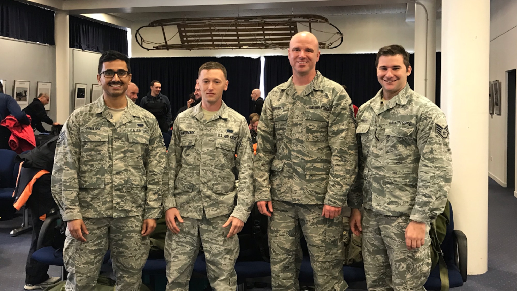 U.S. Air Force Staff Sgt. Titus Poulose (far left), Staff Sgt. Kristofer Vandermark (left), Master Sgt. Chris Farnsworth (right), and Staff Sgt. Michael Jennings (far right) of the 263rd Combat Communications Squadron, a detachment of the 145th Airlift Wing, pose for a photo while deployed to Antarctica in support of Operation Deep Freeze (ODF), at McMurdo Station, Antarctica, Dec. 1, 2018. ODF is a military mission in support of the National Science Foundation throughout the continent of Antarctica, to provide air, land, and sea support to McMurdo Station. (Courtesy Photo submitted by U.S. Air Force Master Sgt. Chris Farnsworth)