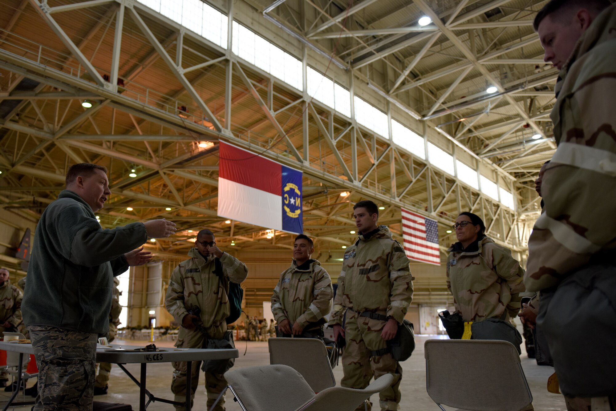 U.S. Air Force Tech. Sgt. Mark Fow, emergency management with the 145th Civil Engineering Squadron, teaches Members of the North Carolina Air National Guard how to read M-9 chemical detection paper during an Ability To Survive and Operate (ATSO) training held in a C-17 Globemaster III hangar at the North Carolina Air National Guard (NCANG) Base, Charlotte Douglas International Airport, Jan. 10, 2019. The ATSO exercise consists of ten rotating stations and serves as refresher training for situations like self-aid buddy care, explosive ordinance device recognition, and chemical warfare decontamination stations.