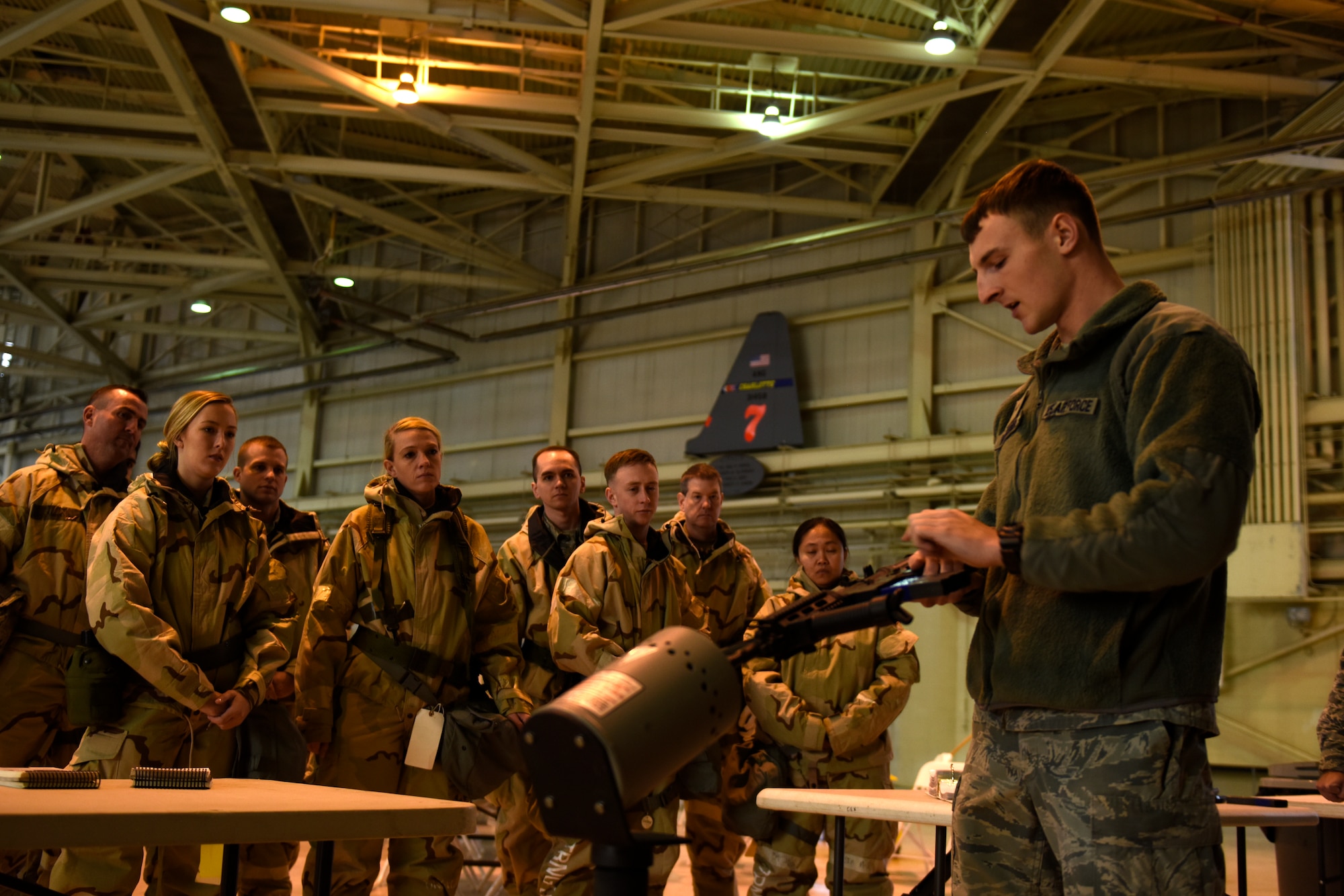 U.S. Air Force Airman 1st Class Brendan Hastings, 145th Security Forces Squadron, teaches Members of the North Carolina Air National Guard how to load a magazine in to an M-4 carbine safely during an Ability To Survive and Operate (ATSO) training held in a C-17 Globemaster III hangar at the North Carolina Air National Guard (NCANG) Base, Charlotte Douglas International Airport, Jan. 10, 2019. The ATSO exercise consists of ten rotating stations and serves as refresher training for situations like self-aid buddy care, explosive ordinance device recognition, and chemical warfare decontamination stations.