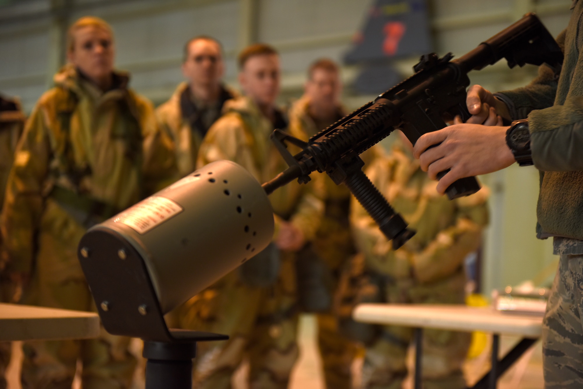 U.S. Air Force Airman 1st Class Brendan Hastings, 145th Security Forces Squadron, teaches Members of the North Carolina Air National Guard how to load a magazine in to an M-4 carbine safely during an Ability To Survive and Operate (ATSO) training held in a C-17 Globemaster III hangar at the North Carolina Air National Guard (NCANG) Base, Charlotte Douglas International Airport, Jan. 10, 2019. The ATSO exercise consists of ten rotating stations and serves as refresher training for situations like self-aid buddy care, explosive ordinance device recognition, and chemical warfare decontamination stations.