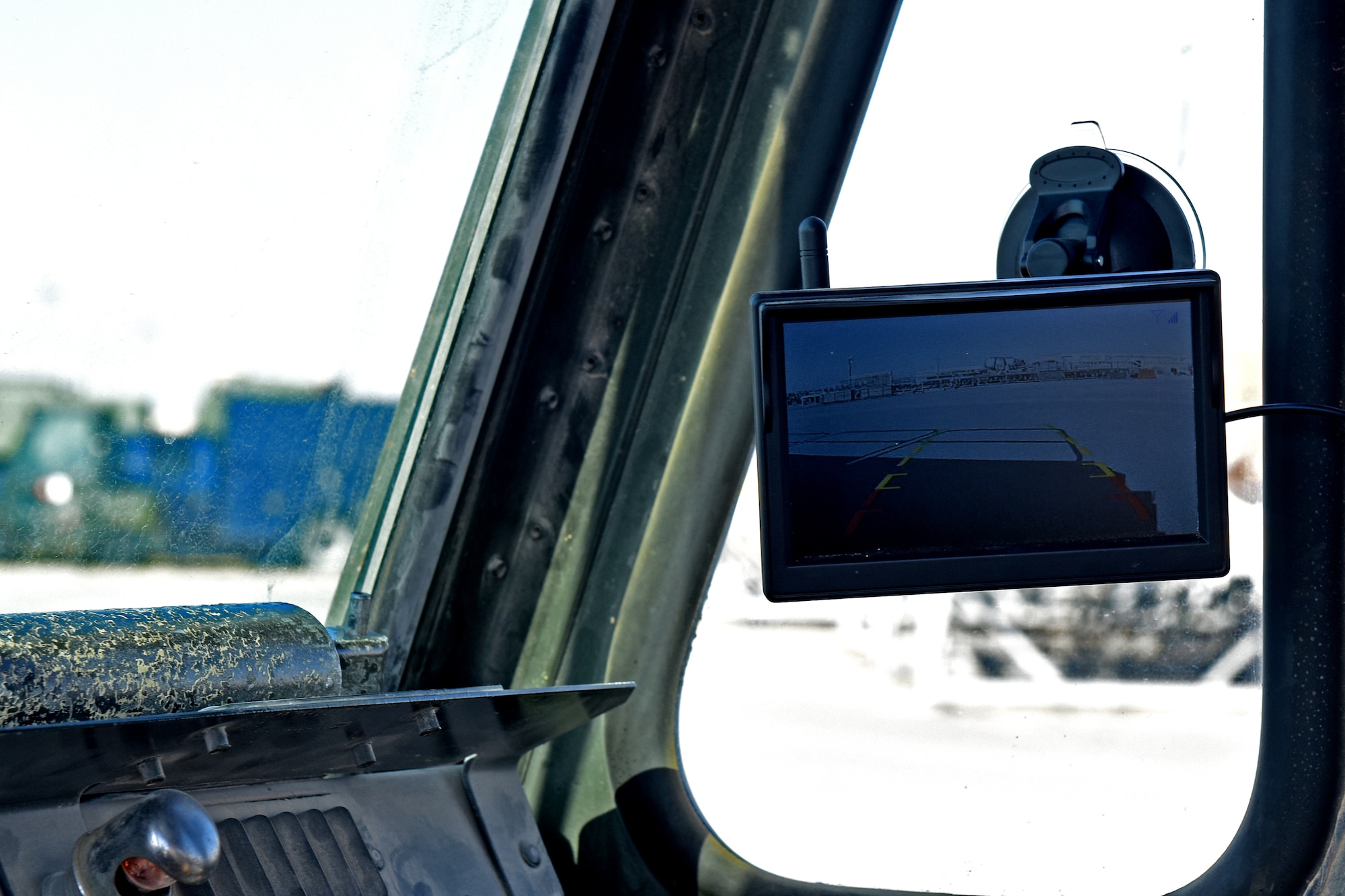 A monitor displays what is behind the Tunner 60K Loader at an undisclosed location in Southwest Asia, Jan. 2, 2019. The newly installed cameras are wired into the electrical system of the K-Loader and the video feed is sent to a monitor in the cabin wirelessly to assist the driver in seeing any possible hazards in the blind spots.