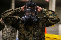 Cpl. Lorenzo Jesus Perez-Tapia removes his M50 Gas Mask Jan. 11, 2019 at Camp Kinser, Okinawa, Japan. Marines trained in reconnaissance, surveillance and decontamination (RS&D) are required to take a refresher course every fiscal quarter to ensure they are capable of performing RS&D tasks operationally. The M50 gas mask gives Marines the ability to breathe in areas exposed to chemical, biological, radiological and nuclear (CBRN) agents. Perez-Tapia, a native of Santa Rosa, California, is a food service specialist with Food Service Company, Combat Logistics Regiment 37, 3rd Marine Logistics Group. (U.S. Marine Corps photo by Lance Cpl. Mark Fike)
