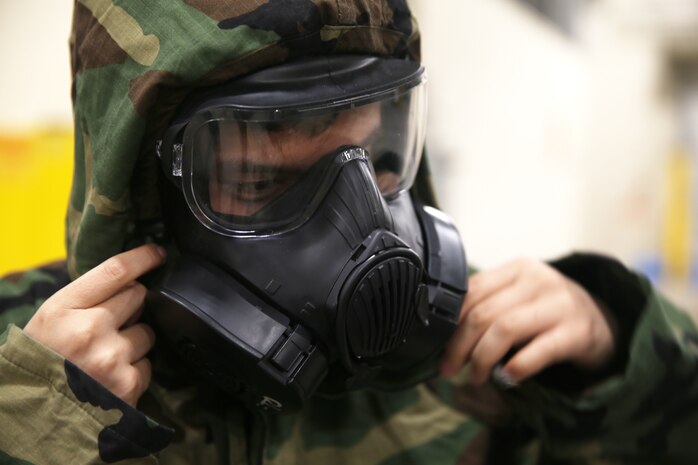 Lance Cpl. Matthew Chant adjusts his M50 gas mask Jan. 11, 2019 at Camp Kinser, Okinawa, Japan. Marines trained in reconnaissance, surveillance and decontamination (RS&D) are required to take a refresher course every fiscal quarter to ensure they are capable of performing RS&D tasks operationally. The M50 gas mask gives Marines the ability to breathe in areas exposed to chemical, biological, radiological and nuclear (CBRN) agents. Chant, a native of San Mateo, California, is a ground electronics telecommunications and information technology systems maintainer with Communications Company, Combat Logistics Regiment Logistics 37, 3rd Marine Logistics Group. (U.S. Marine Corps photo by Lance Cpl. Mark Fike)