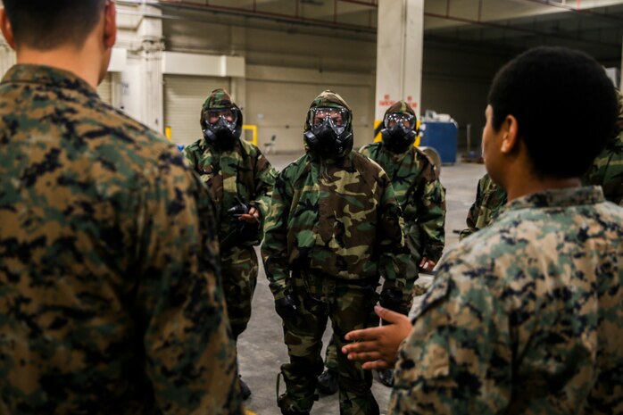 Marines with 3rd Marine Logistics Group practice donning and using protective gear in a chemical, biological, radiological and nuclear (CBRN) environment Jan. 11, 2019 at Camp Kinser, Okinawa, Japan. Marines trained in reconnaissance, surveillance and decontamination (RS&D) are required to take a refresher course every fiscal quarter to ensure they are capable of performing RS&D tasks operationally. (U.S. Marine Corps photo by Lance Cpl. Mark Fike)
