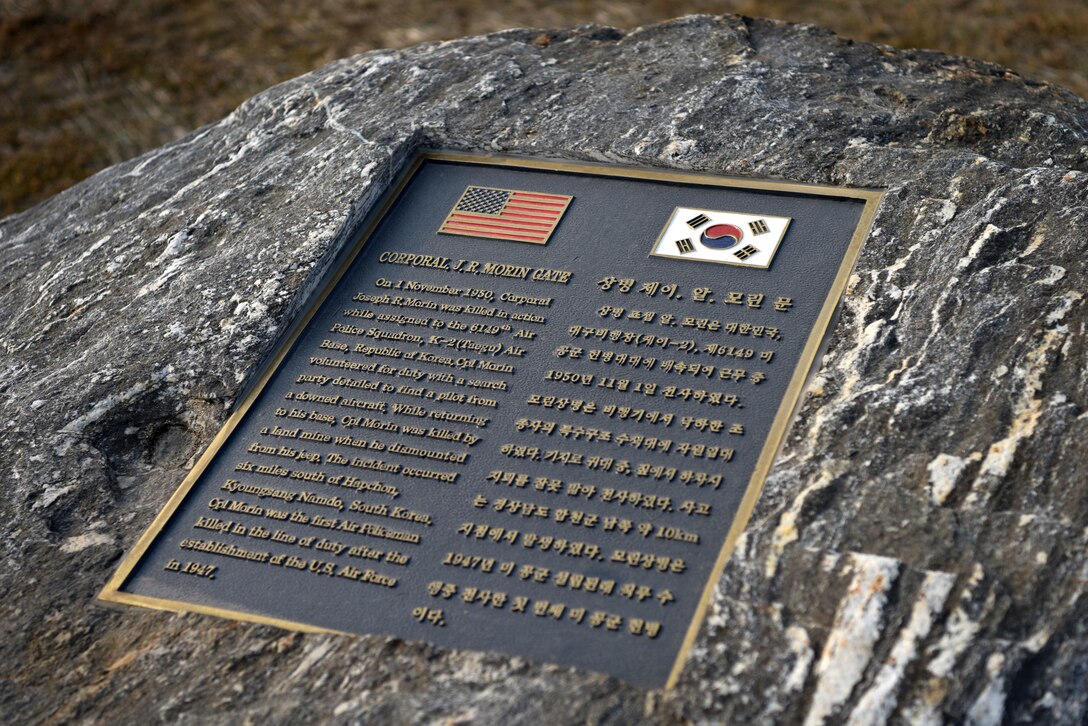 A plaque honors the service of Cpl. Joseph R. Morin, namesake of the newly opened Morin Gate at Osan Air Base, Republic of Korea, Jan. 4, 2019. Morin was the first Air Police member killed in combat action after the establishment of the U.S. Air Force as a separate branch of service. (U.S. Air Force photo by Senior Airman Kelsey Tucker)