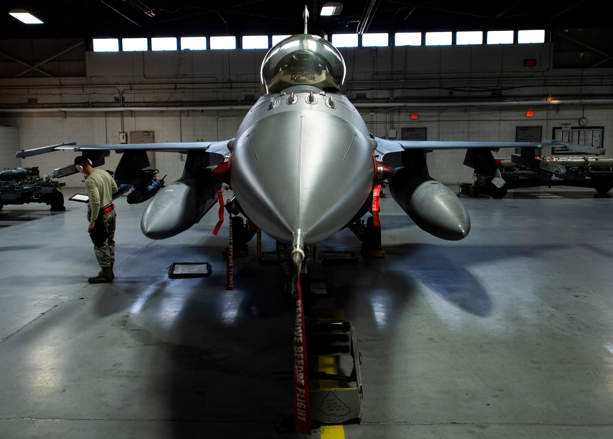 A U.S. Air Force F-16CM Fighting Falcon sits in the 20th Maintenance Group weapons standardization hangar prior to a monthly qualification load at Shaw Air Force Base, S.C., Jan. 10, 2019.