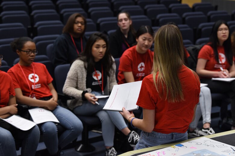 Lakenheath High School students answer questions relating to International Humanitarian Law during the IHL Youth Action Campaign at the school auditorium at Royal Air Force Lakenheath, England, Jan. 12, 2019. The lecture-based training was held on the second day, teaching students about the history of IHL and the Geneva Convention, the challenges health care workers face during armed conflicts, and how to design an IHL campaign.(U.S. Air Force photo by Airman 1st Class Madeline Herzog)