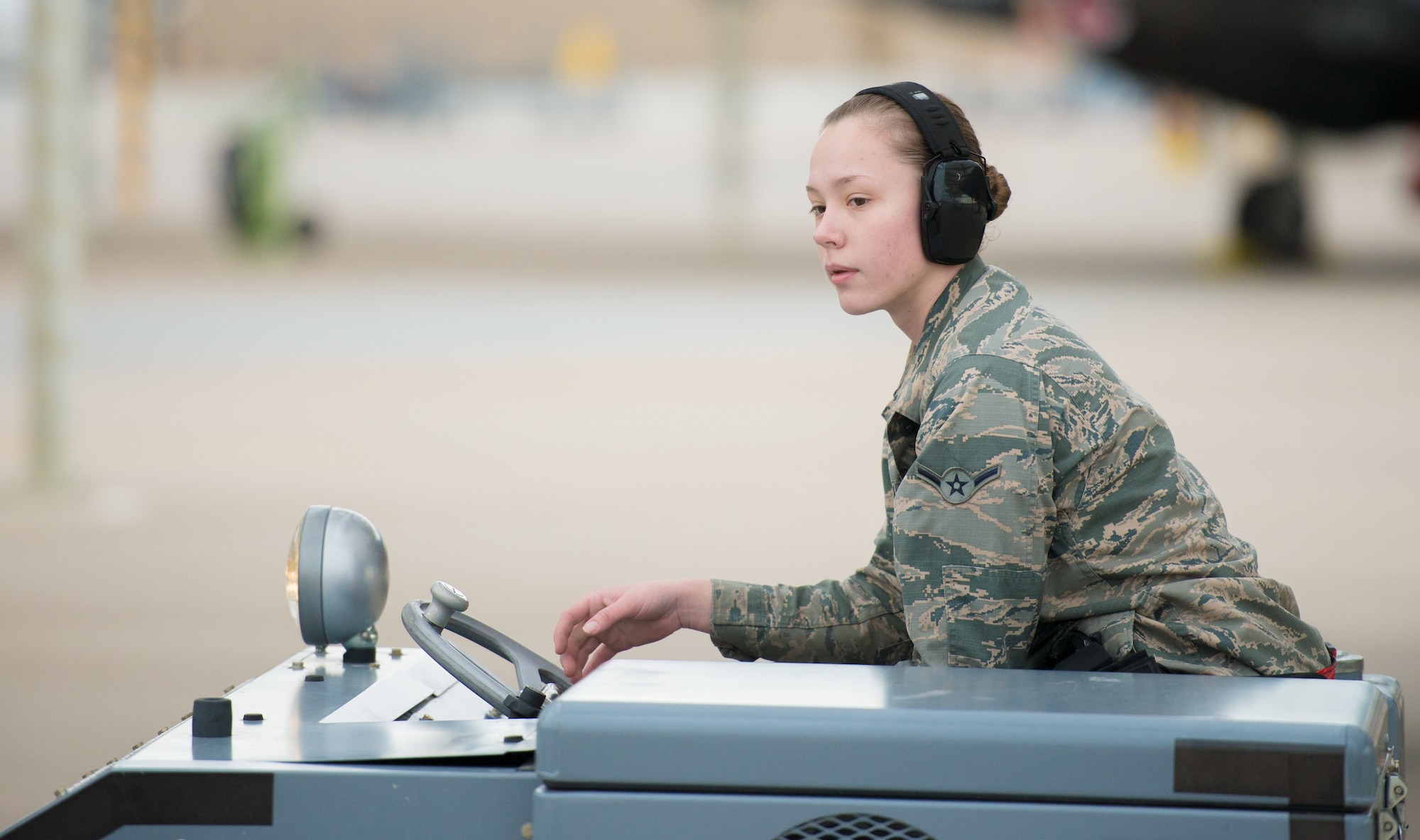 Airman Amanda Knutson, 63rd Aircraft Maintenance Unit load crew team member, drives a bomb loader to pick up inert munitions at Luke Air Force Base, Ariz., Jan. 10, 2019.