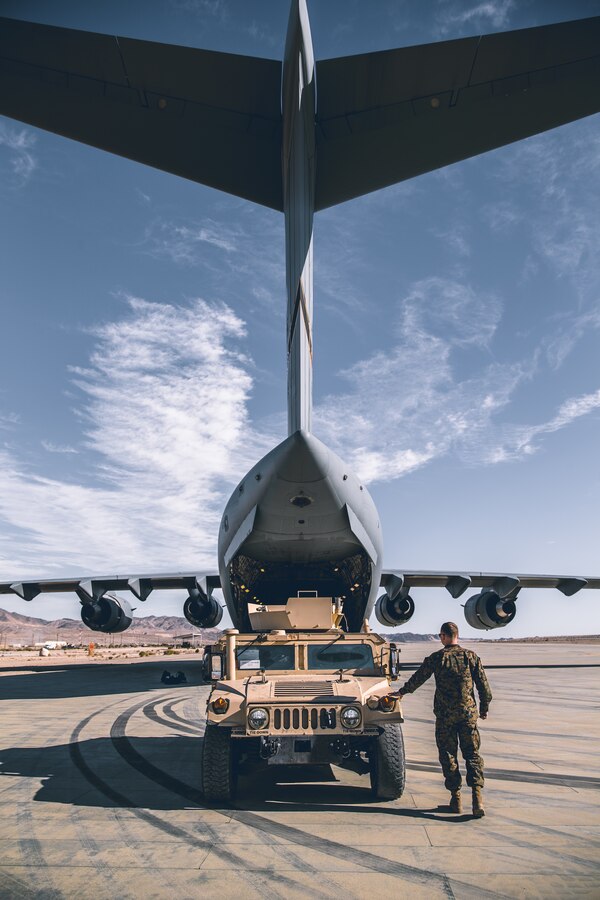 Marines with 2nd Battalion, 7th Marine Regiment, 1st Marine Division load its commands assets onto a C-17 Globemaster III with 729th Airlift Squadron, Air Force Reserve Command, at the Air Combat Element landing strip as a part of a rapid deployment ready exercise at the Marine Corps Air Ground Combat Center, Twentynine Palms, Calif., Nov. 28, 2018. The purpose of this exercise was to display 2nd Battalion, 7th Marine Regiment, 1st Marine Division capabilities to deploy its command assets anywhere around the world in 96 hours within a 24 hour notice. (U.S. Marine Corps photo by Lance Cpl. William Chockey)