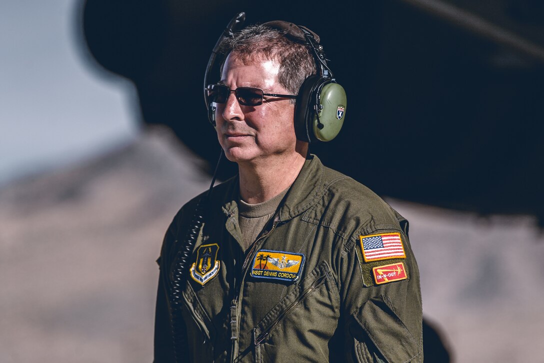 An Airman with the 729th Airlift Squadron, Air Force Reserve Command, guides a Humvee onto a C-17 Globemaster III at the Air Combat Element landing strip as a part of a rapid deployment ready exercise at the Marine Corps Air Ground Combat Center, Twentynine Palms, Calif., Nov. 28, 2018. The purpose of this exercise was to display 2nd Battalion, 7th Marine Regiment, 1st Marine Division capabilities to deploy its command assets anywhere around the world in 96 hours within a 24 hour notice. (U.S. Marine Corps photo by Lance Cpl. William Chockey)