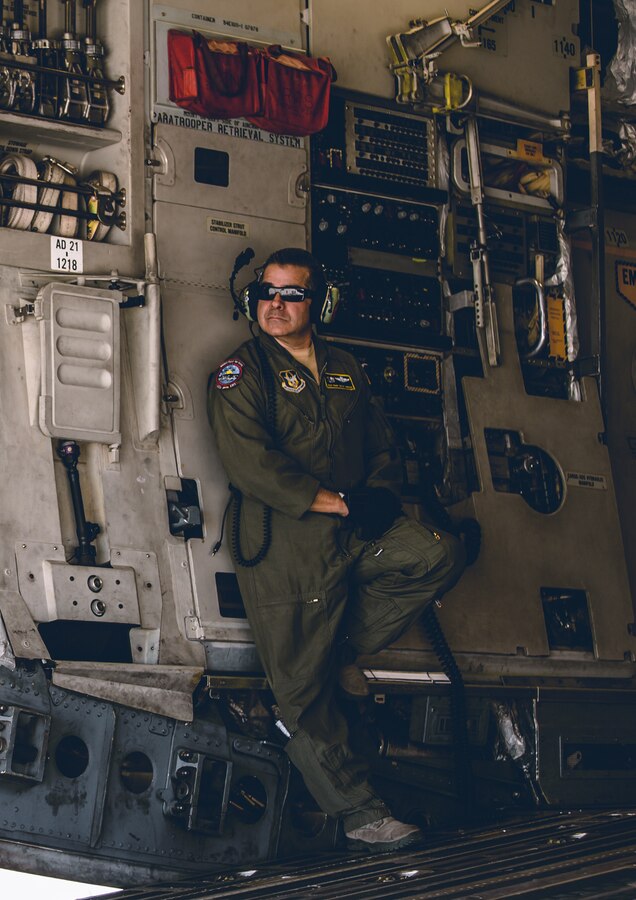 An Airman with the 729th Airlift Squadron, Air Force Reserve Command, oversees the loading of the Cargo onto a C-17 Globemaster III at the Air Combat Element landing strip as a part of a rapid deployment ready exercise at the Marine Corps Air Ground Combat Center, Twentynine Palms, Calif., Nov. 28, 2018. The purpose of this exercise was to display 2nd Battalion, 7th Marine Regiment, 1st Marine Division capabilities to deploy its command assets anywhere around the world in 96 hours within a 24 hour notice. (U.S. Marine Corps photo by Lance Cpl. William Chockey)