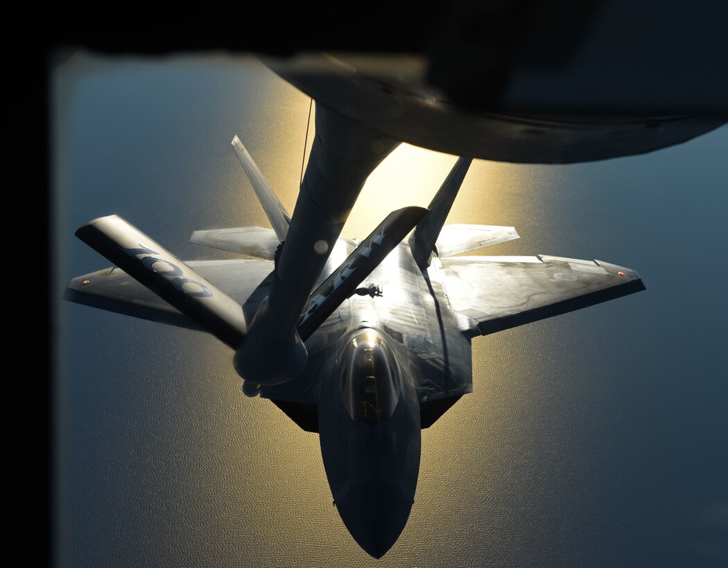An F-22 Raptor flies behind a KC-135 Stratotanker during aerial refueling training off the coast of Finland, Oct 19, 2018.
