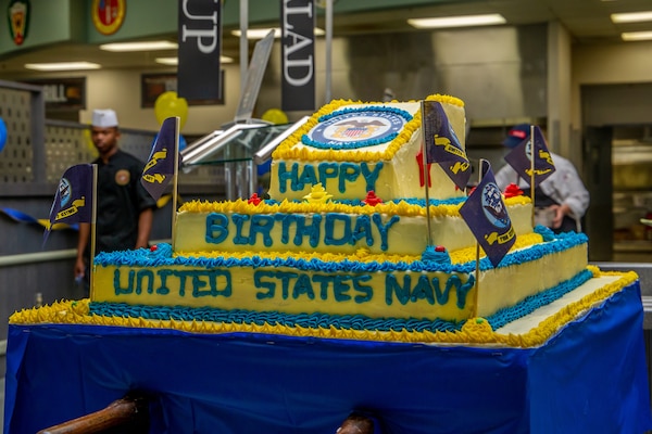 The U.S. Navy celebrates its 243rd birthday with a cake at Phelps Chow Hall, aboard Marine Corps Air Ground Combat Center, Twentynine Palms, Calif., Oct. 11, 2018. The local chow halls aboard the Combat Center also provided steak and lobster entrees to all personnel to honor the birthday. Founded on Oct. 13, 1775, the Continental Navy was created by Congress to defend and protect American coastal communities and colonies from British attacks, and to disrupt British communications. (U.S. Marine Corps photo by Lance Cpl. Rachel K. Young)