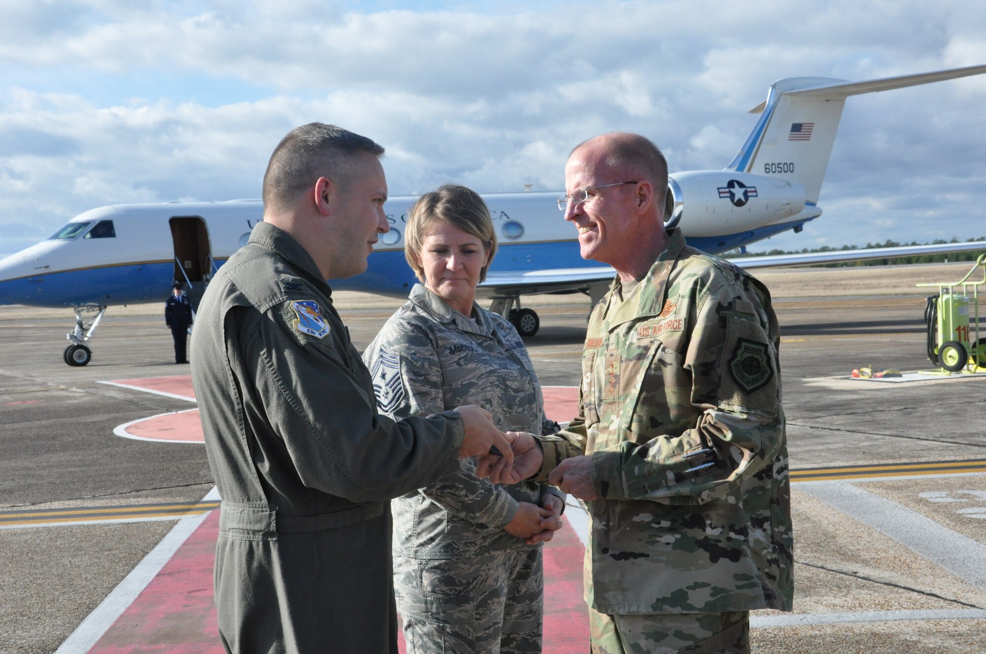 Photo of Col. David Abba, 53rd Wing commander, Chief Master Sergeant Kathy McCool, and Air Force Vice Chief of Staff Gen. Stephen W. Wilson at Eglin AFB, Florida