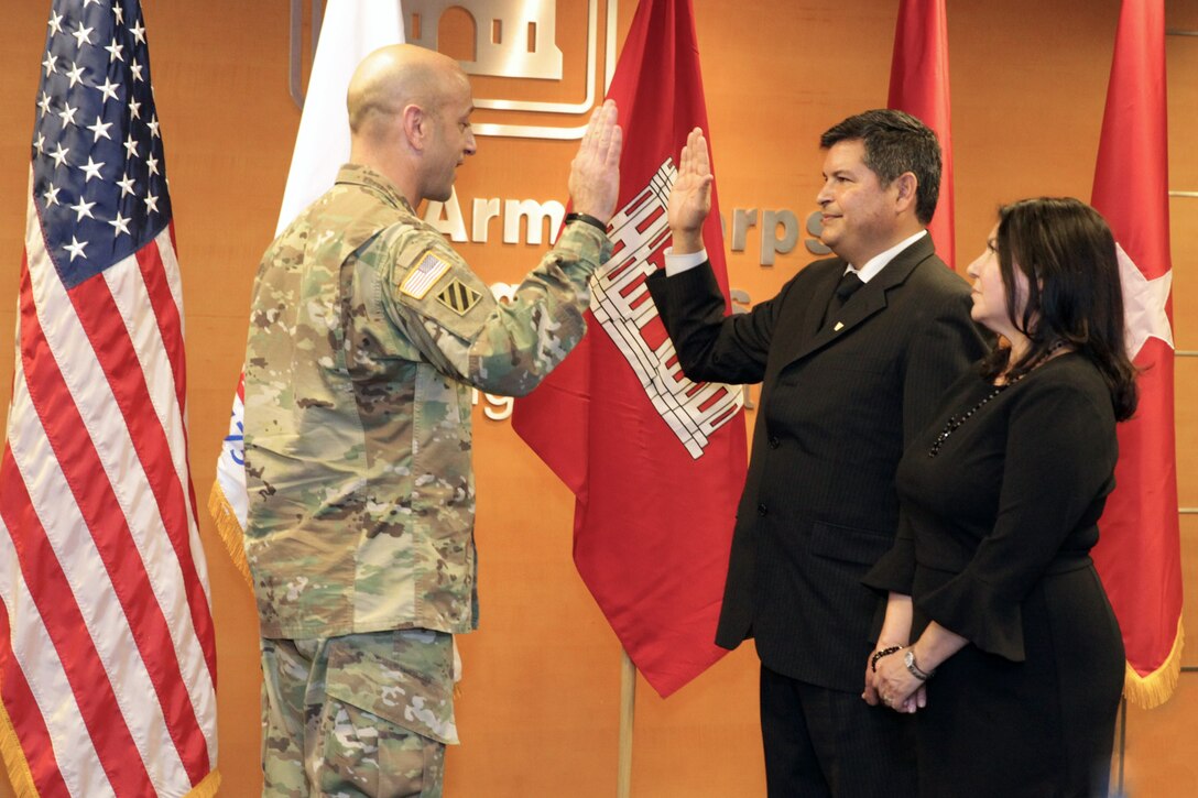 USACE Deputy Commanding General for Civil and Emergency Operations Maj. Gen. Scott Spellmon inducted South Pacific Division Regional Business Director John Moreno into the Senior Executive Service at a ceremony in the Los Angeles District Jan. 10. Moreno’s wife Joann, grandson Edward Lopez, and nephew Jonathan Ochoa participated in the presentation of the induction pin, reciting of the oath of office, and uncasing and unfurling of the flag of the Senior Executive Service. Moreno has more than 26 years of experience with the Corps and now provides executive leadership and direction for the South Pacific Division and its four subordinate Districts in operating as a Regional Business Center.