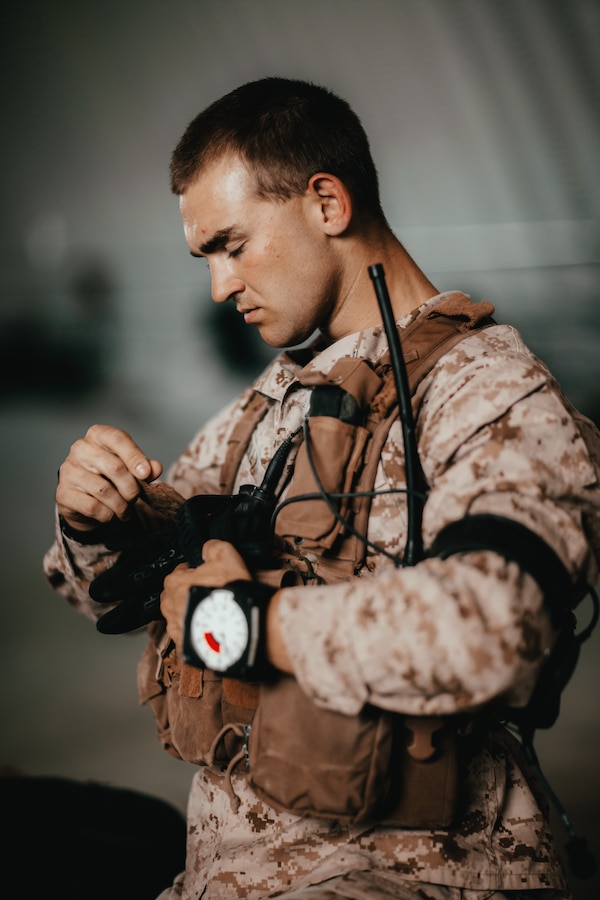 A Marine with 3rd Reconnaissance Battalion, 3rd Marine Division, III Marine Expeditionary Force, prepares his gear at Marine Corps Air Ground Combat Center, Twentynine Palms, Calif., Oct. 25, 2018, as a part of Integrated Training Exercise 1-19. The purpose of ITX is to create a challenging, realistic training environment that produces combat-ready forces capable of operating as an integrated Marine Air Ground Task Force. (U.S. Marine Corps Photo by Sgt. Joshua Elijah Chacon)