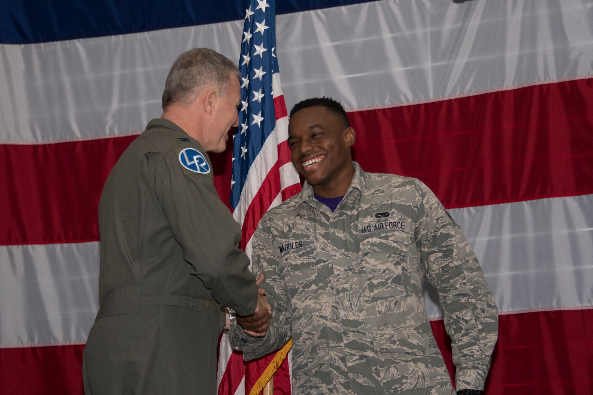 U.S. Air Force Col. Robert VanHoy, 307th Bomb Wing commander, and Chief Master Sgt. Darren Demel, 307th BW command chief, recognized three Community College of the Air Force graduates during a commander's call at Barksdale Air Force Base, Louisiana, Jan. 13, 2019.  Those receiving degrees are Tech. Sgt. John Hanks, Staff Sgt. William Monteagudo, and Staff Sgt. Trevor Talbert. (U.S. Air Force photo by Airman 1st Class Maxwell Daigle)