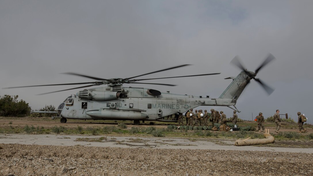 U.S. Marines with Marine Wing Support Squadron (MWSS) 373, Marine Wing Support Group (MWSG) 37, 3rd Marine Aircraft Wing (MAW), unload gear from a CH-53E Super Stallion on the runway at Airport in the Sky on Catalina Island, California, Jan. 9, 2019. The partnership between the Marine Corps and the Catalina Island Conservancy provides a unique opportunity to conduct applicable training while also helping the community. (U.S. Marine Corps photo by Cpl. Samuel Ruiz)