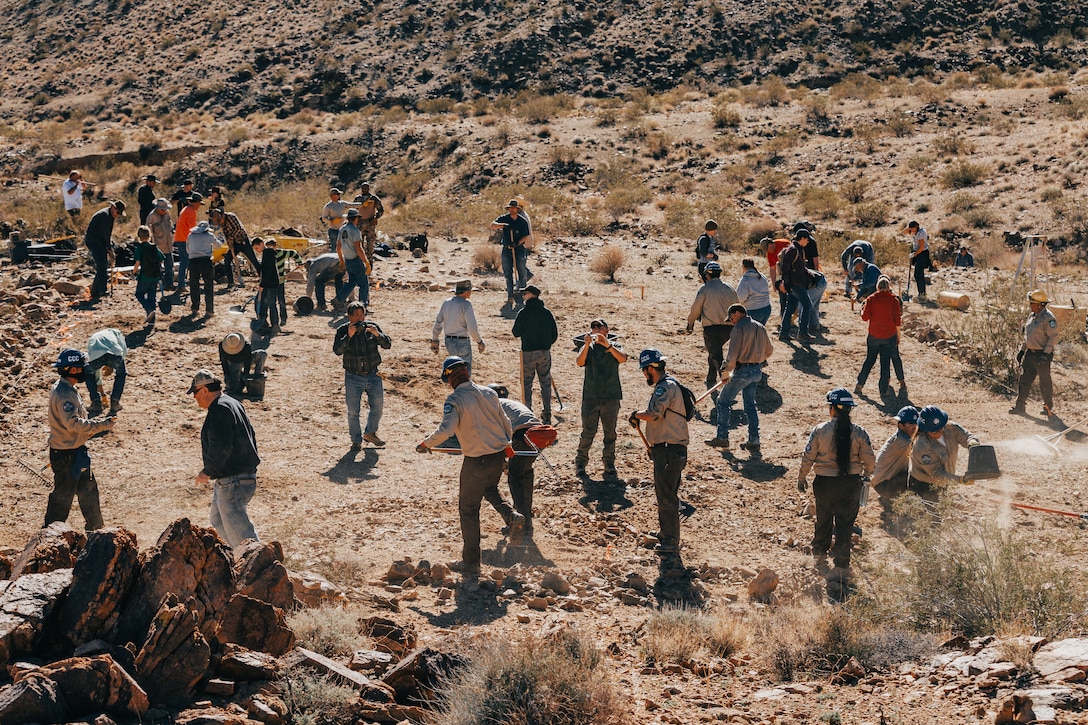 Volunteers begin construction on a water guzzler at Marine Corps Air Ground Combat Center, Twentynine Palms, Calif., Jan. 4, 2019. Members of the San Bernadino County community joined together with the California Conservation Corps to build a water guzzler in an effort to provide natural resources needed to sustain the bighorn sheep population in the surrounding area. (U.S. Marine Corps photo by Lance Cpl. Aaron Harshaw)