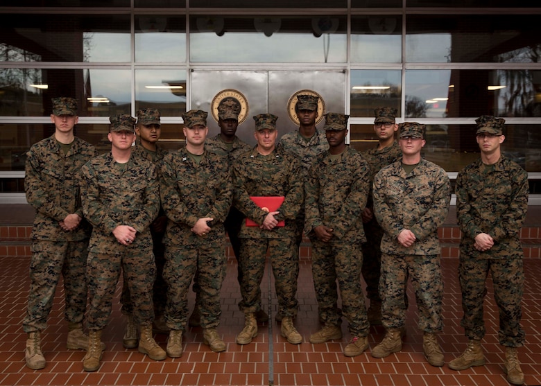 U.S. Marine Corps Chief Warrant Officer Matthew Kessinger, personnel officer of 6th Marine Corps District, poses for a photo with the 6th MCD personnel section after his promotion to chief warrant officer five aboard Marine Corps Recruit Depot Parris Island, South Carolina, Dec. 19, 2018. Kessinger, a native of Louisville, Kentucky, has currently served 28 years in the Marine Corps. (U.S. Marine Corps photo by Lance Cpl. Jack A. E. Rigsby)
