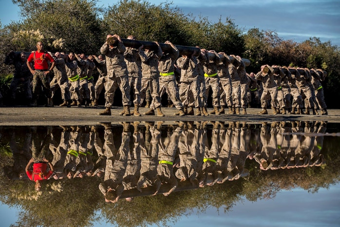 Recruits with Charlie Company, 1st Recruit Training Battalion, carry a log during a log drill exercise at Marine Corps Recruit Depot San Diego, Jan. 7.