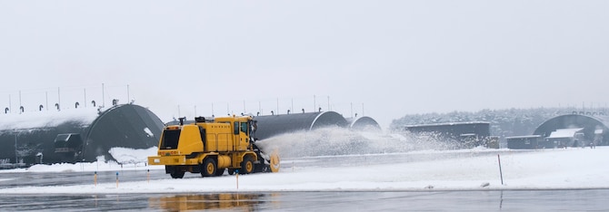 Members with the 35th Civil Engineer Squadron clear snow off the flight line at Misawa Air Base, Japan, Dec. 12, 2018. The 35th CES clears the flight line to create a safe environment for F-16s to takeoff and maintain wing readiness. (U.S. Air Force photo by 1st Lt. Jeremy Garcia)