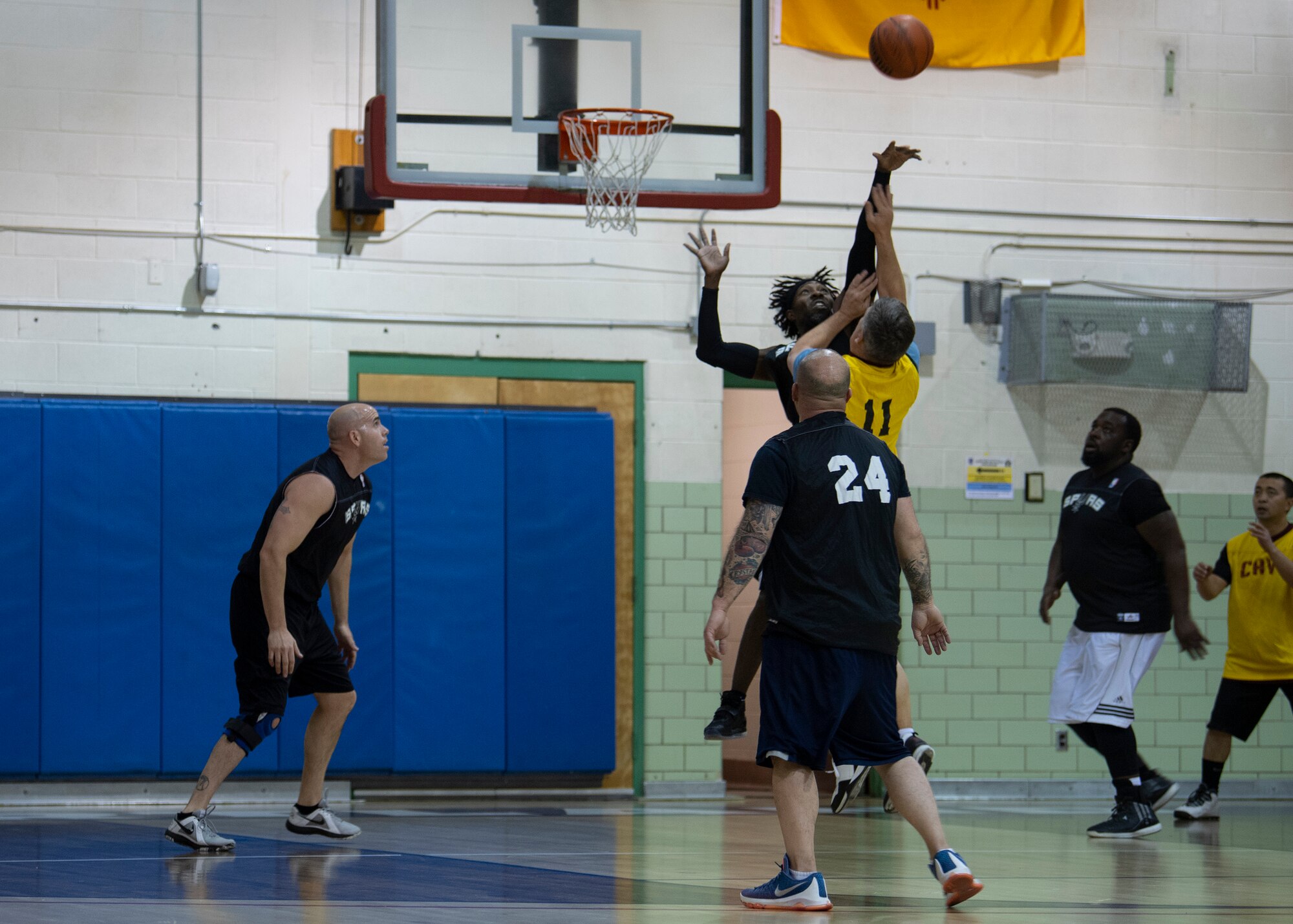 Leon Gibbs, 377th Force Support Squadron forward, blocks a shot of a Group Three team member during an over 35 intramural basketball game at Kirtland Air Force Base, N.M., Jan. 9, 2019. Gibbs’ scoring led his team to victory after 40 minutes of play. (U.S. Air Force photo by Staff Sgt. J.D. Strong II)