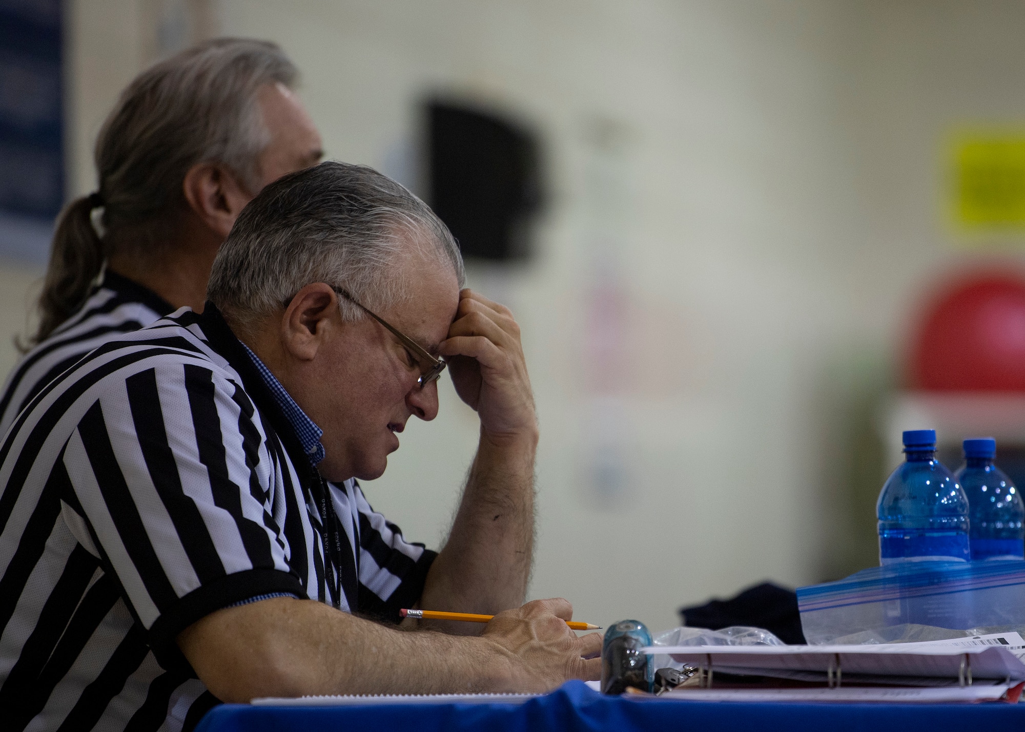 Victor LaBella, referee, keeps score during an over 35 intramural basketball game at Kirtland Air Force Base, N.M., Jan. 9, 2019. Labella is a training technician assigned to the 377th Force Support Squadron. (U.S. Air Force photo by Staff Sgt. J.D. Strong II)