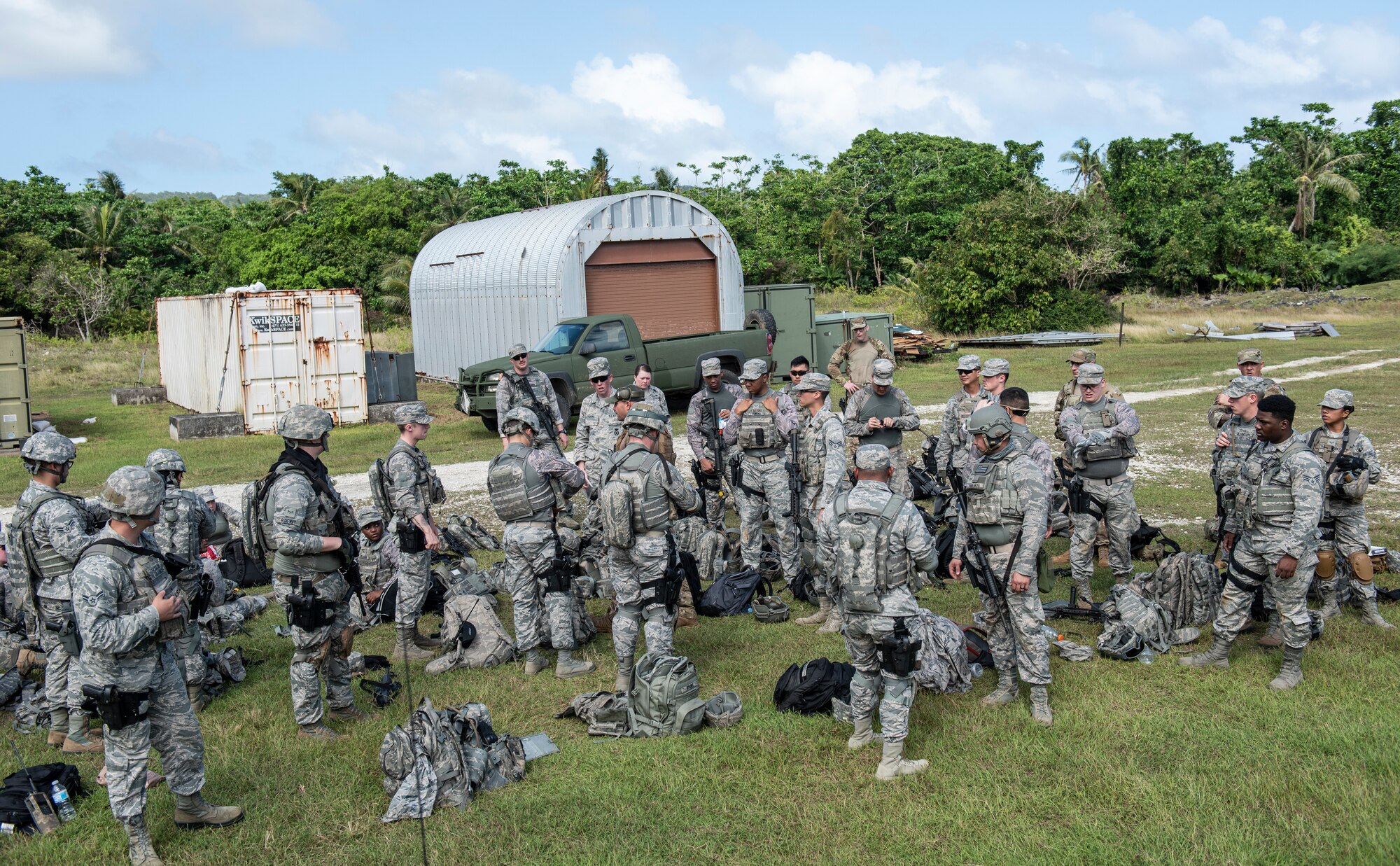 Students await instruction during tier 1 and 2 Commando Warrior training at North West Field near Andersen Air Force Base, Guam Dec. 10, 2018. The 14-day course was hosted by the 736th Security Forces Squadron and encompassed convoy operations, counter improvised explosive devices, navigation, advanced weapons tactics, and other skills to promote base and mobile security. (U.S. Air Force photo by Master Sgt. JT May III)