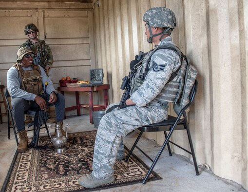 Senior Airman Joshua Mims, 736th Security Forces Squadron, plays the role of a village elder during a key leader engagement as Staff Sgt. Seth Gordon, 374th Security Forces Squadron patrolman from Yokota Air Base, Japan, questioned him during Commando Warrior training Dec. 11, 2018. The training took place at North West Field near Andersen Air Force Base, Guam. Sixty-eight active duty and Air National Guard members completed the 14-day course Dec. 14, 2018. (U.S. Air Force photo by Master Sgt. JT May III)