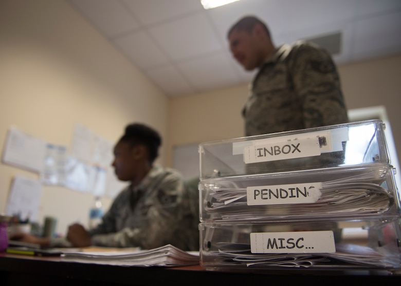 U.S. Air Force Staff Sgt. Charnae Simon, 39th Force Support Squadron Military Personnel Flight NCO in charge of career development, and U.S. Air Force Staff Sgt. Maximiliano Estrada, 39th FSS MPF NCO in charge of customer service, process paperwork at Incirlik Air Base, Turkey, Nov. 27, 2018.