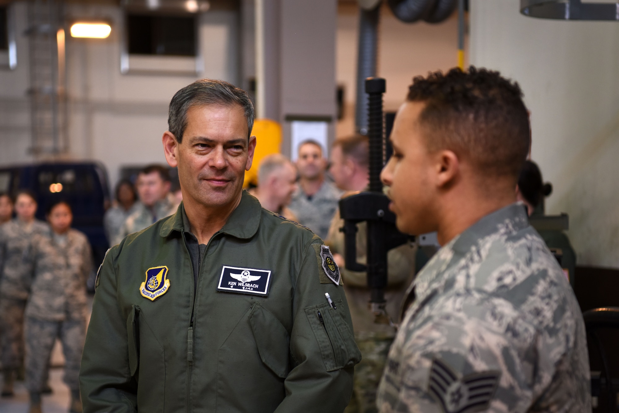 U.S. Air Force Lt. Gen. Kenneth Wilsbach, 7th AF commander, speaks with Staff Sgt. Michael Clark, 51st Logistics Readiness Squadron fuels knowledge operations specialist, during an immersion tour at Osan Air Base, Republic of Korea, Jan. 11, 2019. Clark spoke about subjects regarding the fuels management flight personnel, facilities, and scope of responsibility. (U.S. Air Force photo by Senior Airman Kelsey Tucker)