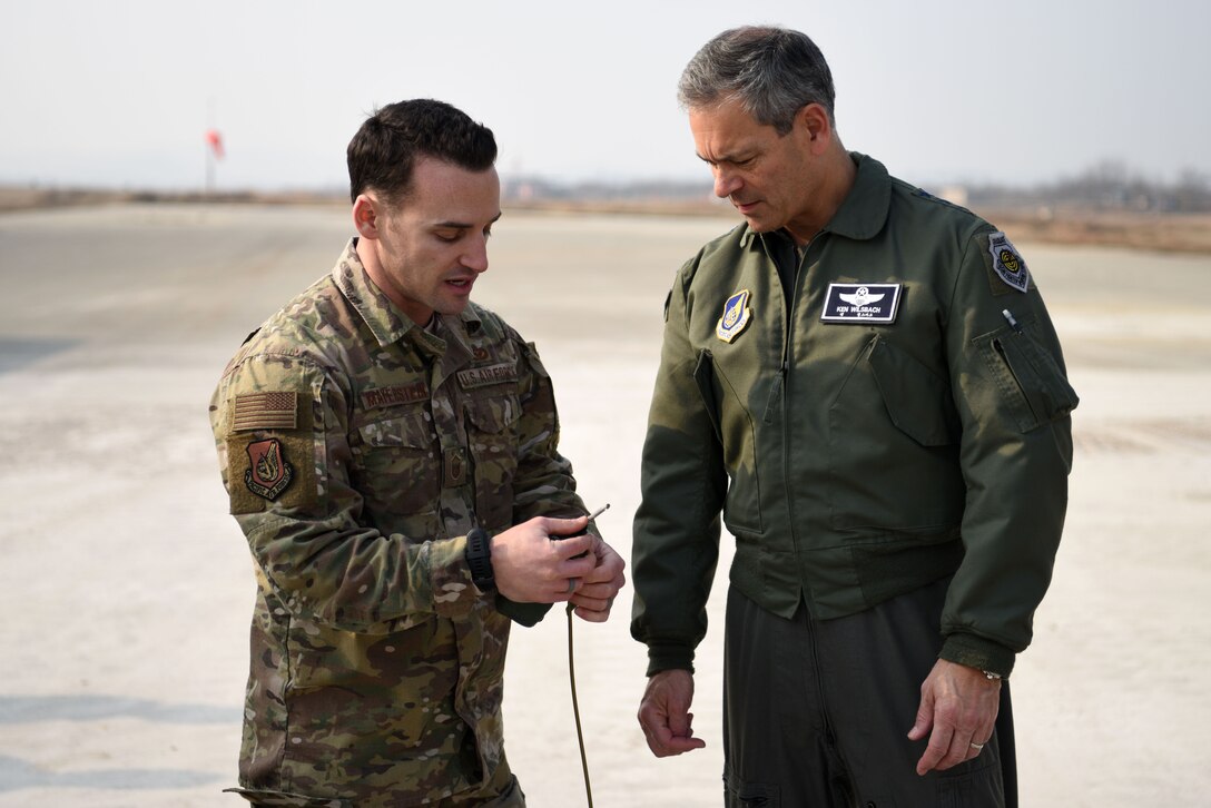 U.S. Air Force Lt. Gen. Kenneth Wilsbach, 7th AF commander, speaks with Master Sgt. Layne Mayerstein, 51st Civil Engineer Squadron explosive ordnance disposal flight chief, during an immersion tour at Osan Air Base, Republic of Korea, Jan. 11, 2019. Mayerstein spoke about the EOD side of Rapid Airfield Damage Repair, including methods of dealing with unexploded explosive ordnance on the flightline. (U.S. Air Force photo by Senior Airman Kelsey Tucker)