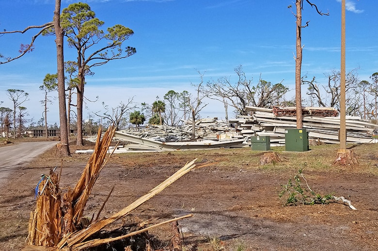 Steel beams await disposal at a Tyndall Air Force Base scrap staging area.