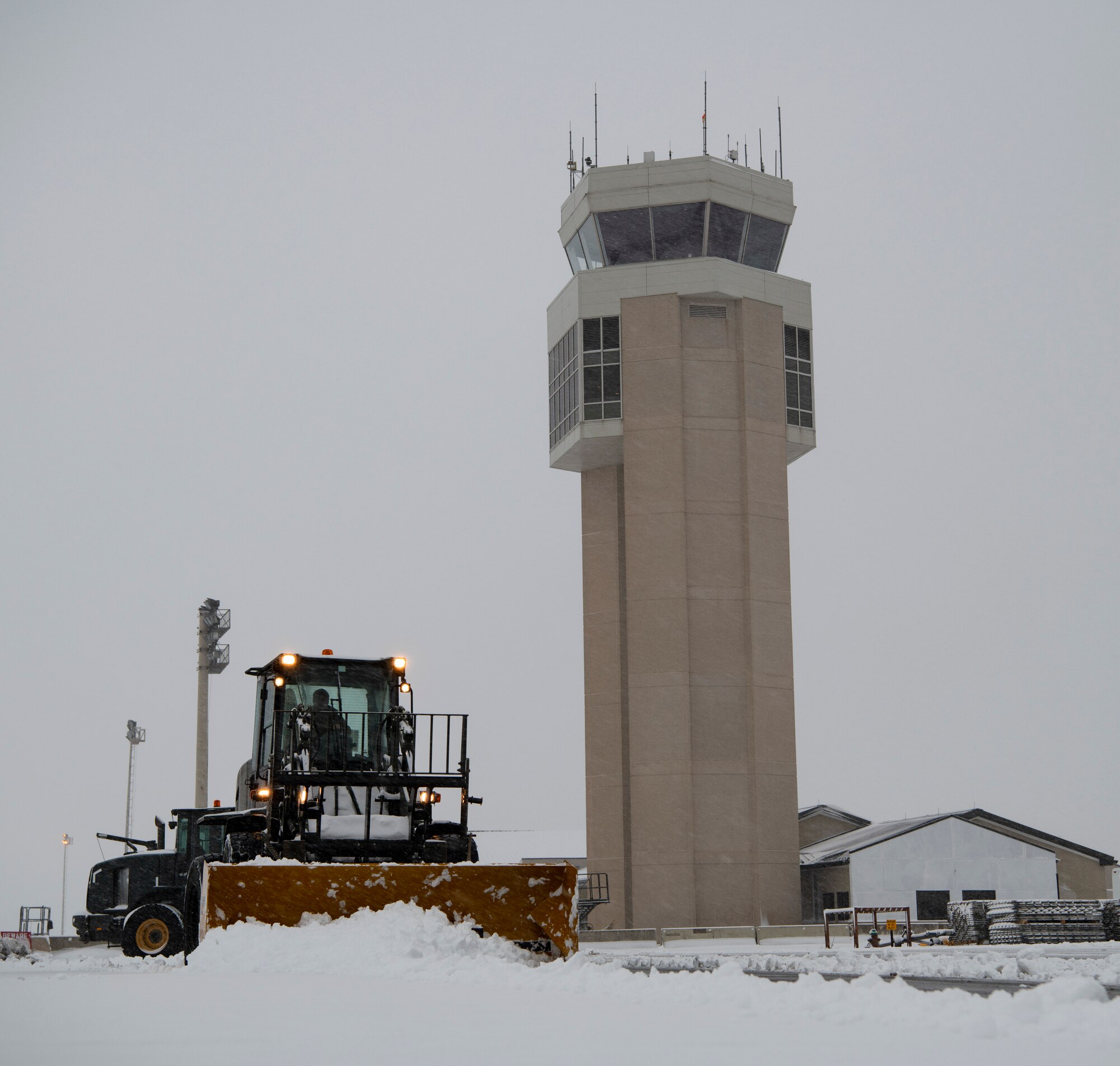 Team Dover Airmen respond to winter Storm Gia on January 13, 2019, at Dover Air Force Base, Del. This was the first snow of the new year with approximately 4 inches reported. (U.S. Air Force photo by Airman 1st Class Zoe M. Wockenfuss)