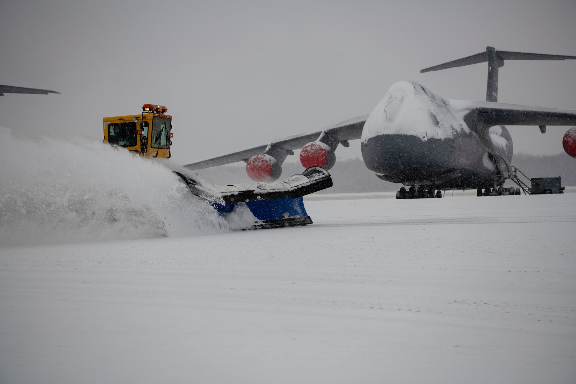 Team Dover Airmen respond to winter Storm Gia on January 13, 2019, at Dover Air Force Base, Del. This was the first snow of the new year with approximately 4 inches reported. (U.S. Air Force photo by Airman 1st Class Zoe M. Wockenfuss)