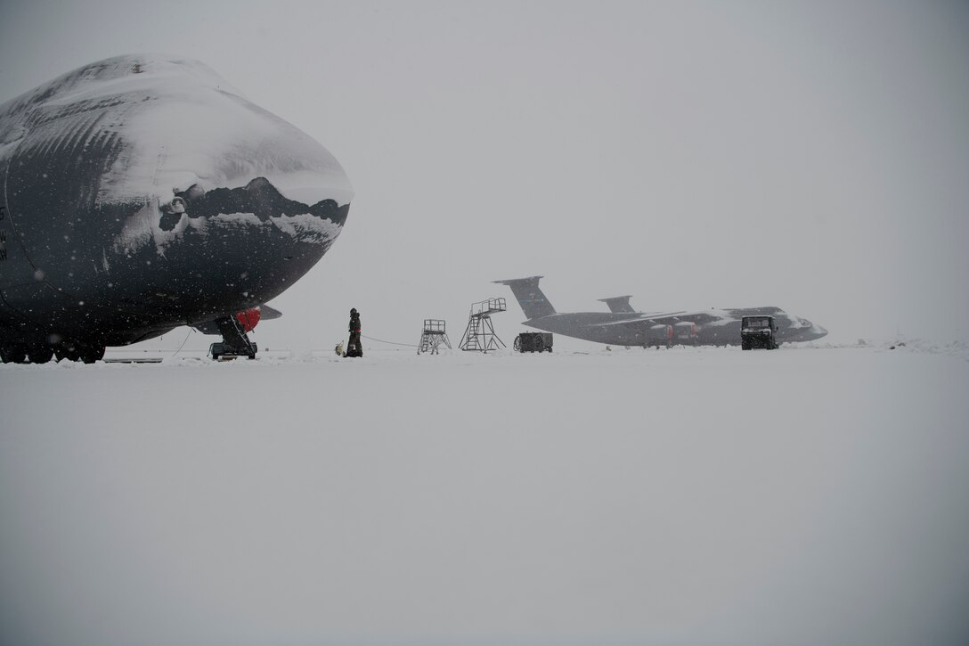 Team Dover Airmen respond to winter Storm Gia on January 13, 2019, at Dover Air Force Base, Del. This was the first snow of the new year with approximately 4 inches reported. (U.S. Air Force photo by Airman 1st Class Zoe M. Wockenfuss)