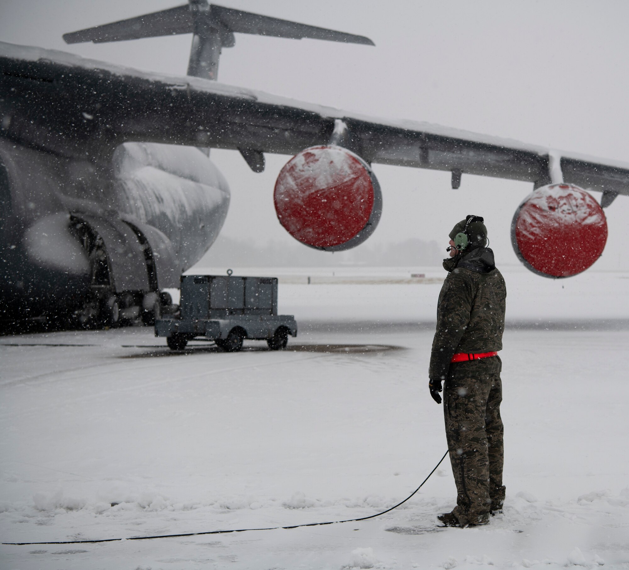 Team Dover Airmen respond to winter Storm Gia on January 13, 2019, at Dover Air Force Base, Del. This was the first snow of the new year with approximately 4 inches reported. (U.S. Air Force photo by Airman 1st Class Zoe M. Wockenfuss)