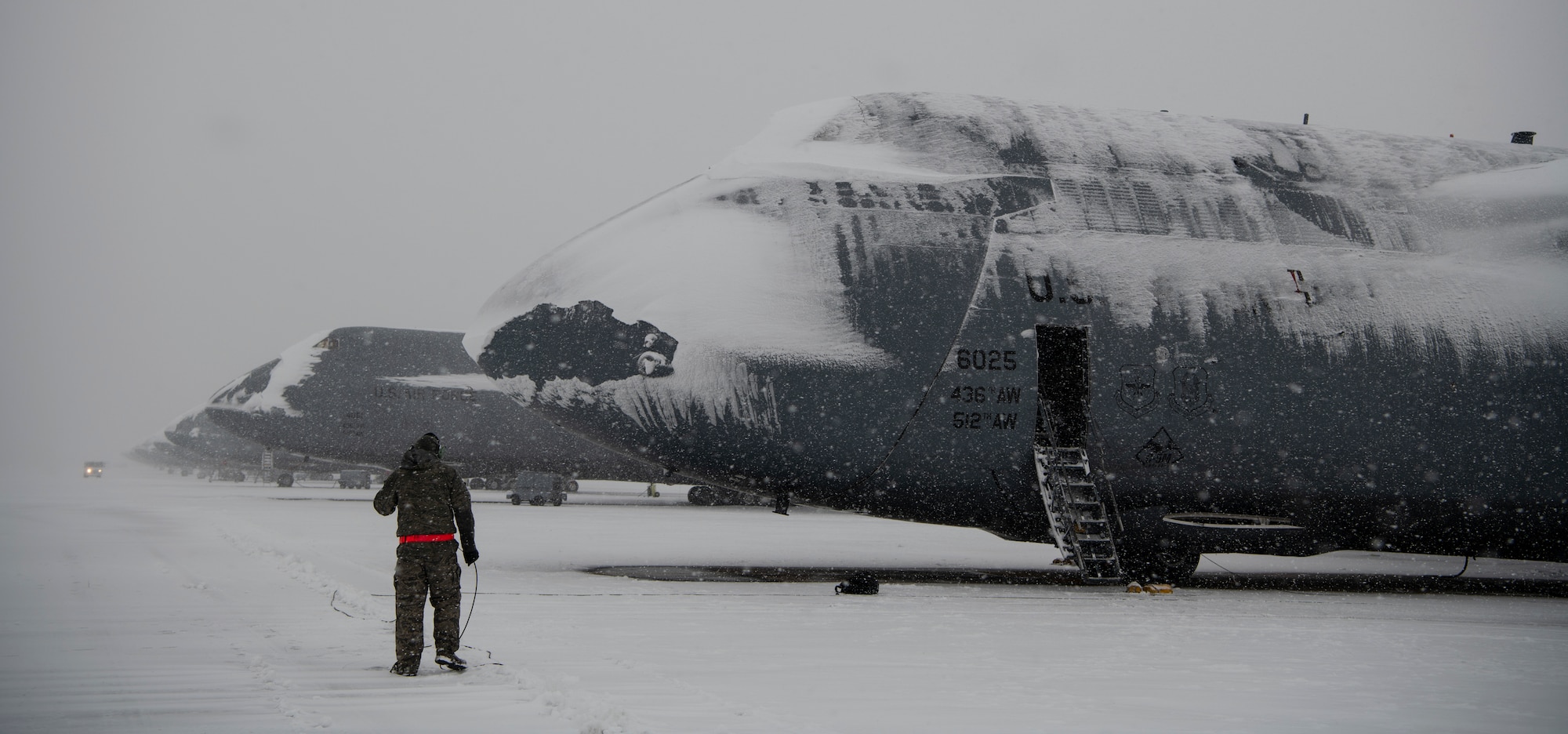 Team Dover Airmen respond to winter Storm Gia on January 13, 2019, at Dover Air Force Base, Del. This was the first snow of the new year with approximately 4 inches reported. (U.S. Air Force photo by Airman 1st Class Zoe M. Wockenfuss)