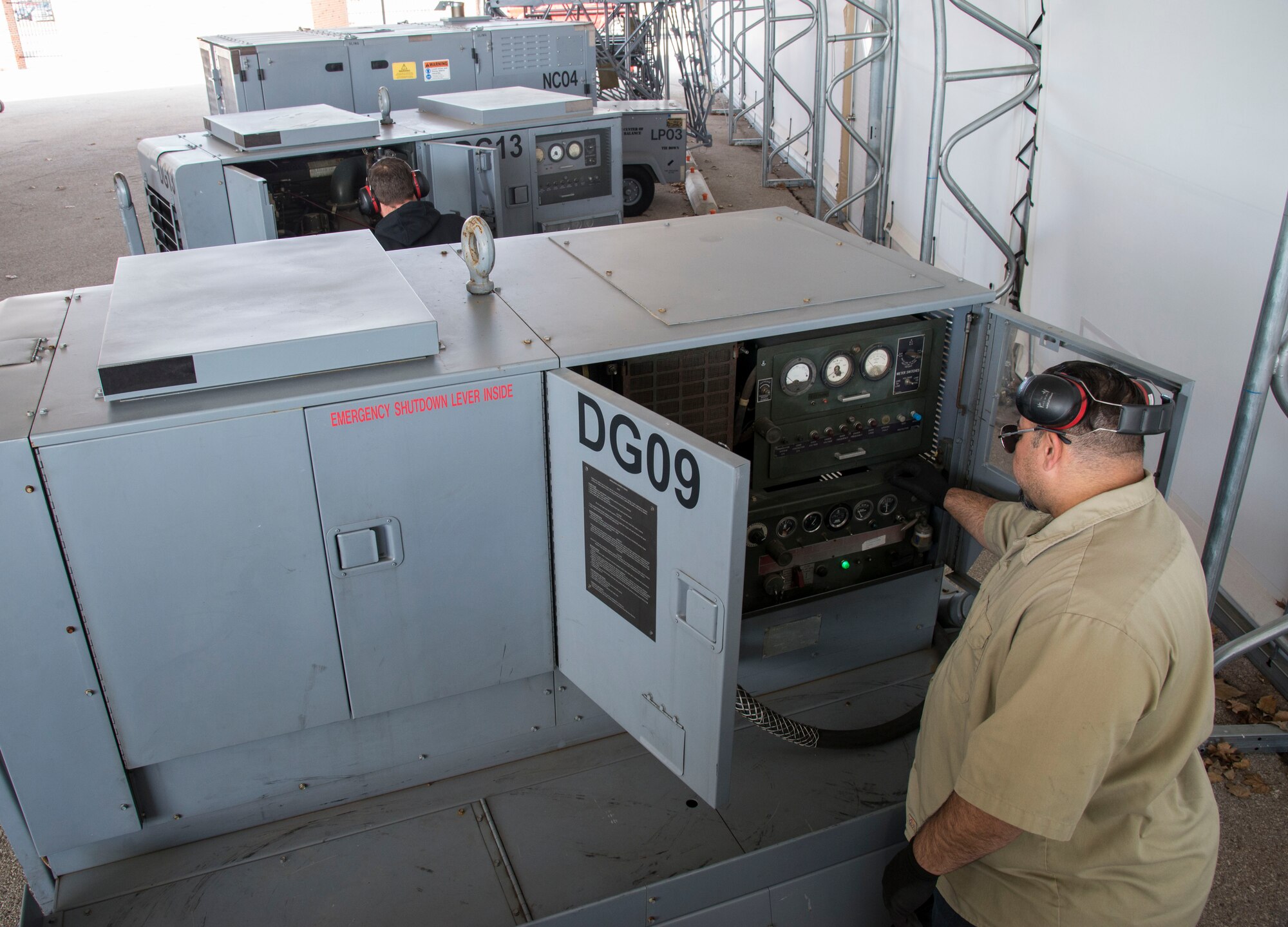 Ernesto Realsantana, 375th Operations Support Squadron aerospace ground mechanic, conducts an operational check on an aircraft generator at Scott Air Force Base, Illinois, Dec.12, 2018. AGE is responsible for making sure that all the equipment needed by transient aircraft stopping at Scott AFB are properly maintained.