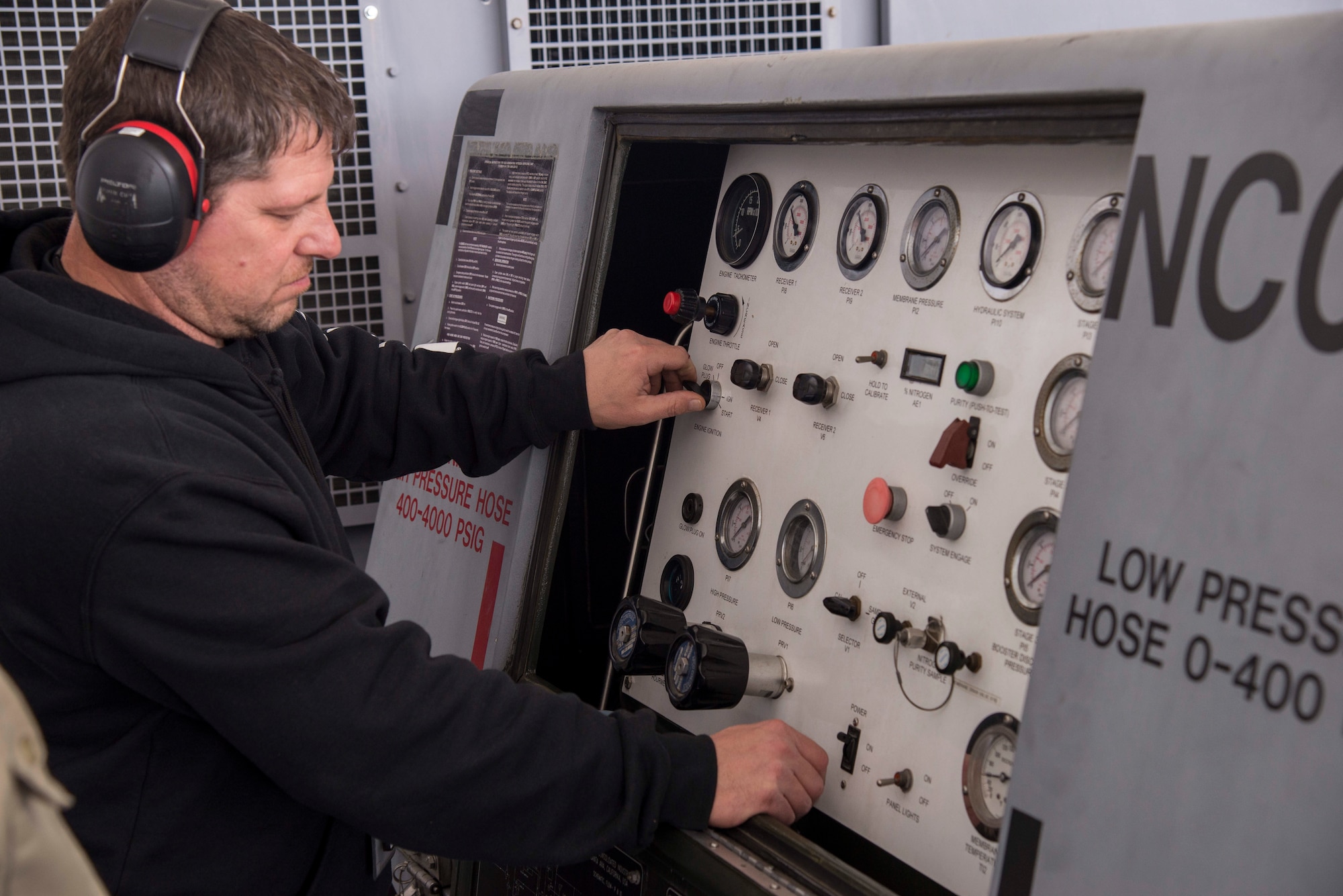 Jeff Dalton, 375th Operations Support Squadron aerospace ground mechanic, performs an operational check on a self-generating nitrogen service cart at Scott Air Force Base, Illinois Dec. 12, 2018. Nitrogen carts are one of the many different pieces of equipment used by Aerospace Ground Equipment to help maintainers service aircraft on the flight line.