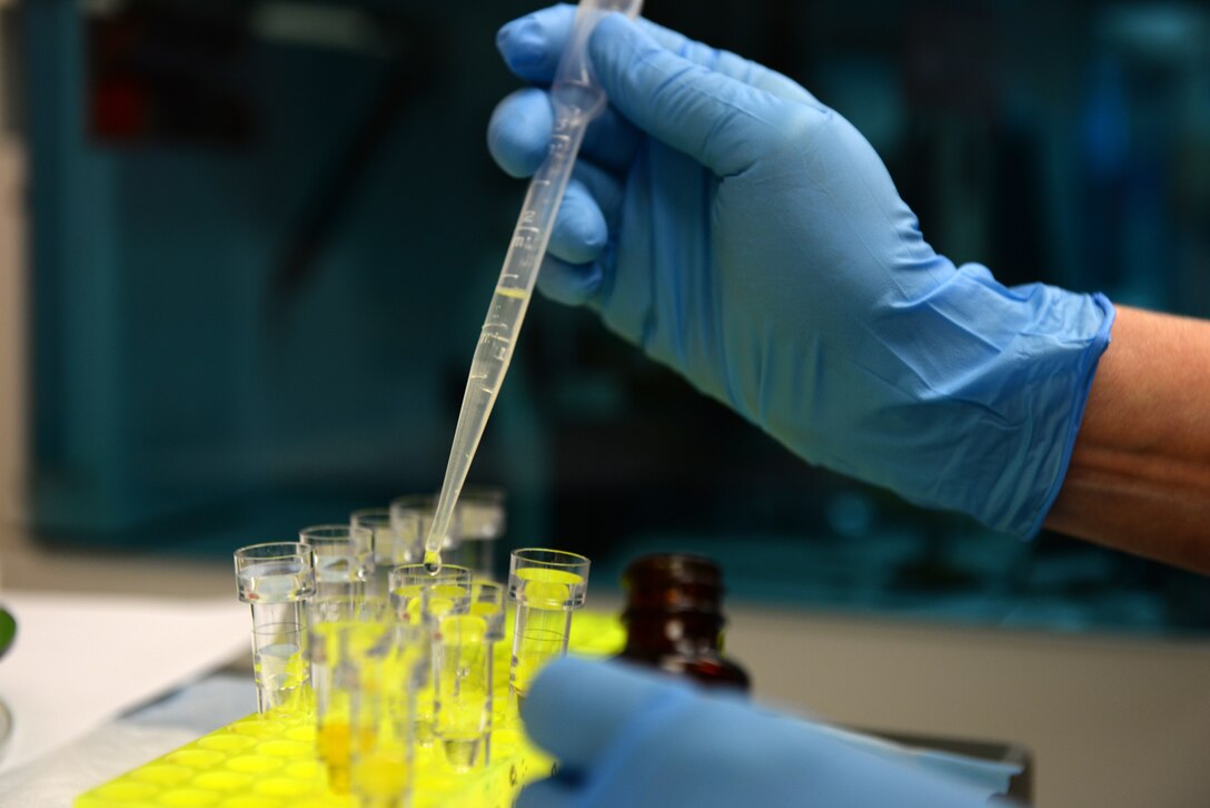 Patti James, a 28th Medical Support Squadron medical laboratory technologist, fills vials of control specimens for a medical centrifuge at Ellsworth Air Force Base, S.D., Dec. 4, 2018. Before loading the day's medical samples, a control group must be tested to ensure accurate results. (U.S. Air Force photo by Airman 1st Class Nicolas Z. Erwin)