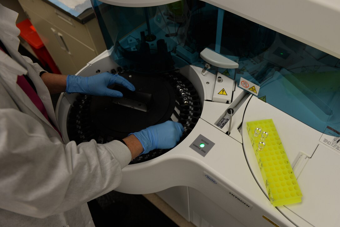 Patti James, a 28th Medical Support Squadron medical laboratory technologist, loads control specimens into a medical centrifuge at Ellsworth Air Force Base, S.D., Dec. 4, 2018. After a control group has been tested, technicians use a previously tested specimen from earlier that week to cross-check the validity of the results. (U.S. Air Force photo by Airman 1st Class Nicolas Z. Erwin)