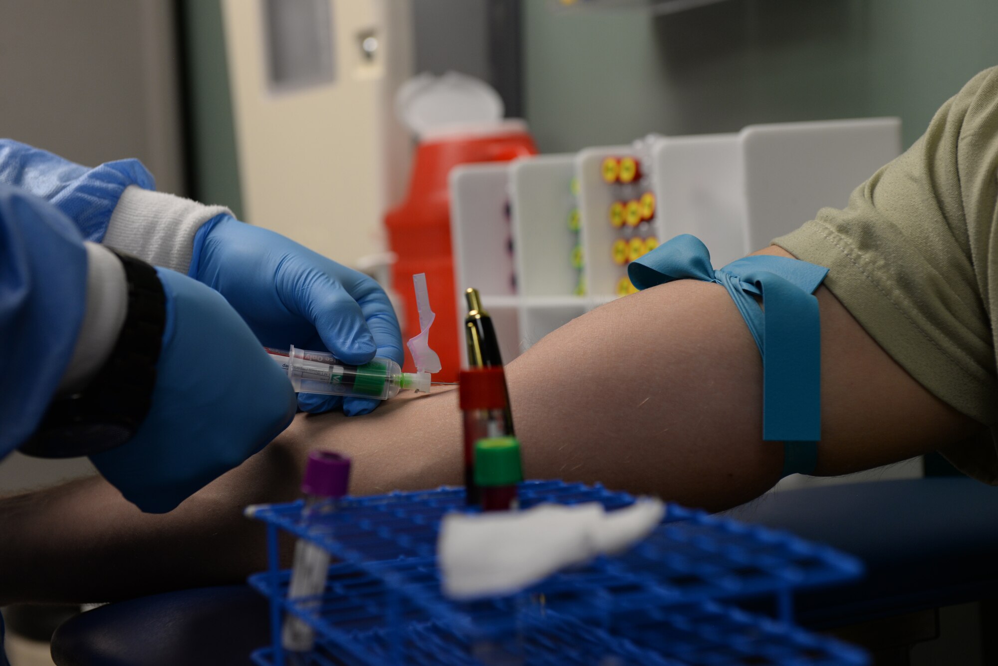 Airman 1st Class Mitchell Rostollan, a 28th Medical Support Squadron medical laboratory technician, draws an Airman's blood at Ellsworth Air Force Base, S.D., Dec. 4, 2018. The 28th Medical Group lab handles urinalysis, deployment readiness, sexually transmitted infection testing and other specialized functions for Department of Defense employees, retirees and families. (U.S. Air Force photo by Airman 1st Class Nicolas Z. Erwin)